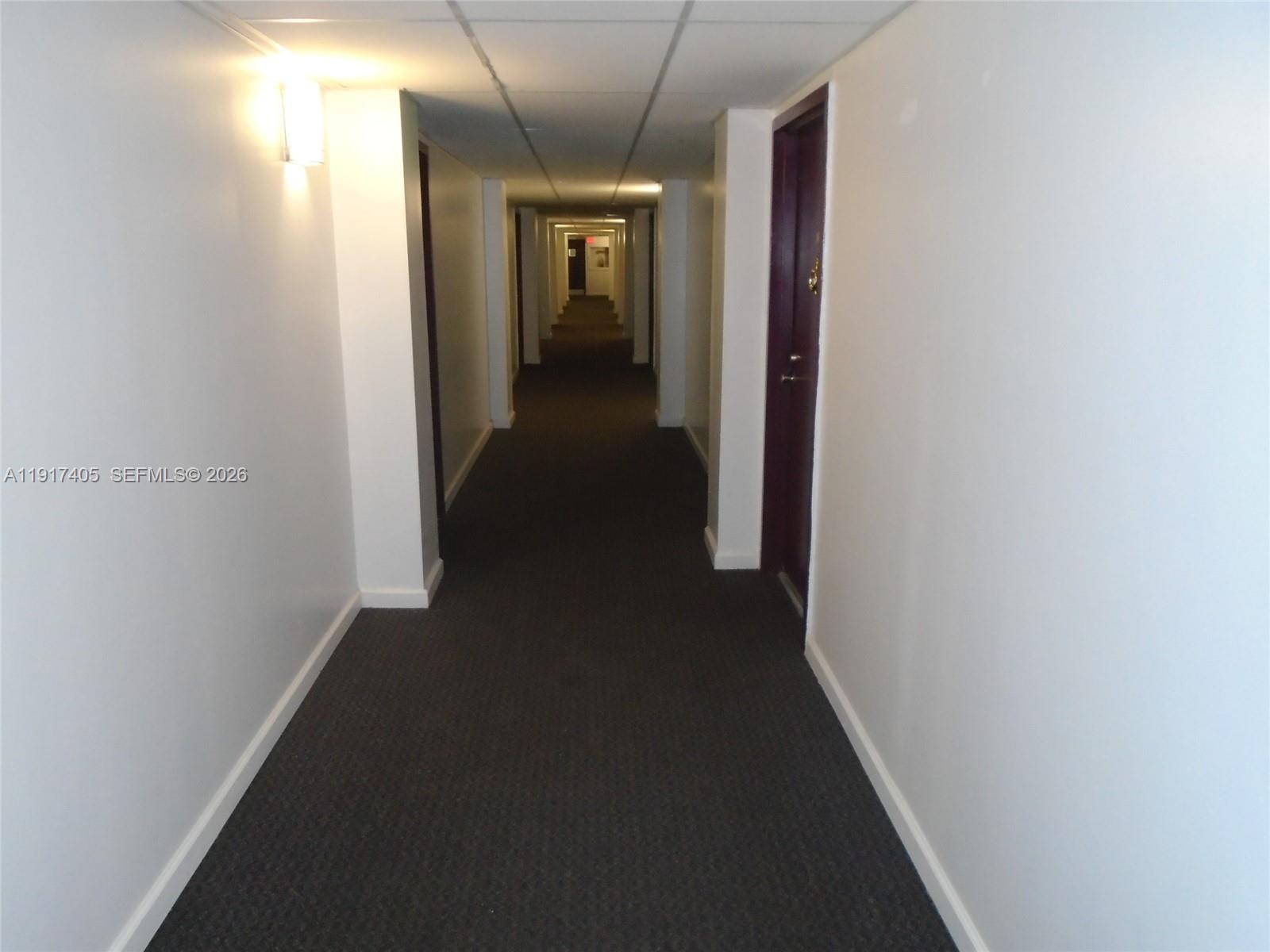 4174 Inverrary Drive, Unit 1003 Lauderhill, FL 33319 - Photo 3 of 30 a view of a hallway with wooden floor