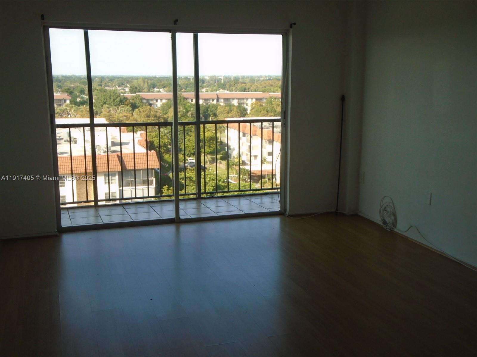 4174 Inverrary Drive, Unit 1003 Lauderhill, FL 33319 - Photo 5 of 28 a view of a large window with wooden floor in living room