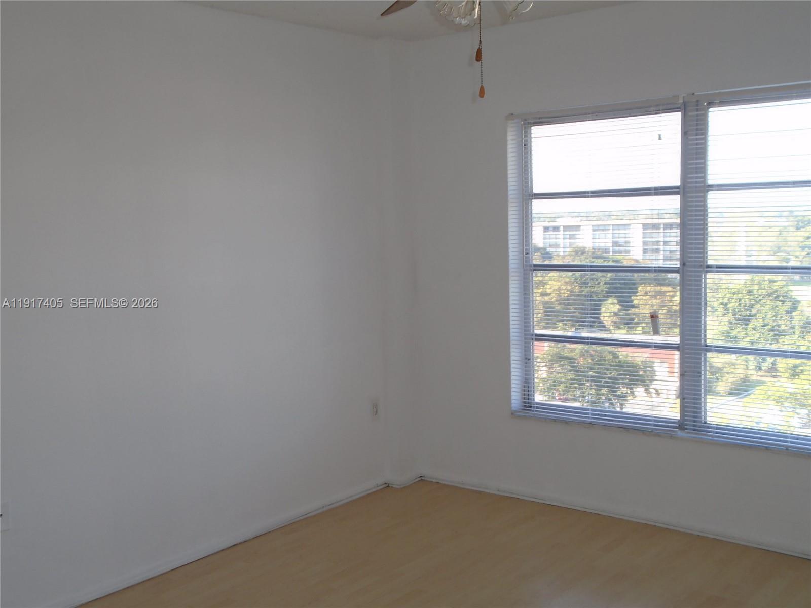 4174 Inverrary Drive, Unit 1003 Lauderhill, FL 33319 - Photo 6 of 30 an empty room with a window