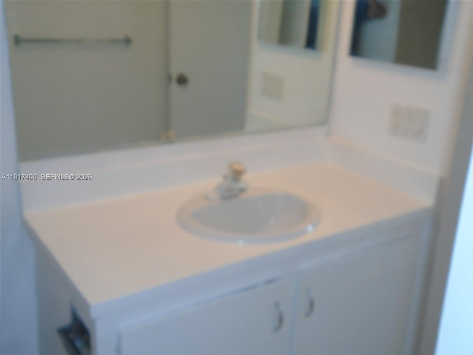 4174 Inverrary Drive, Unit 1003 Lauderhill, FL 33319 - Photo 7 of 30 a bathroom with a sink