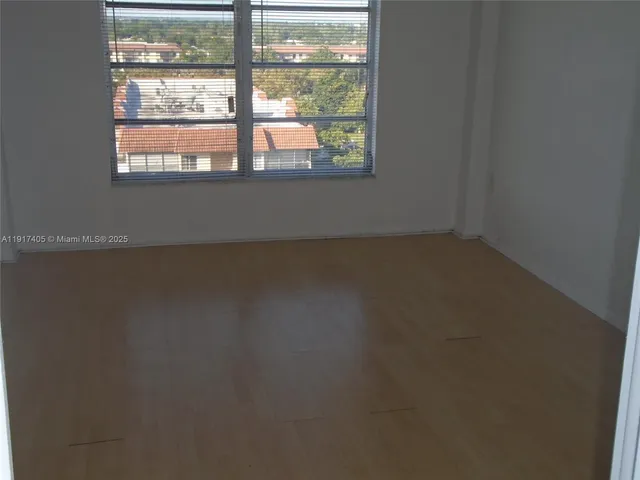 a view of a room that has a window in it