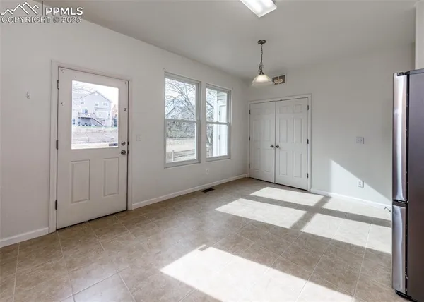 a view of an empty room with a window
