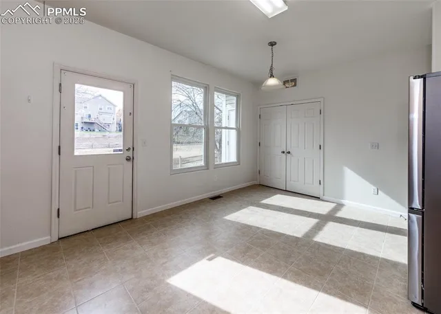 a view of an empty room with a window