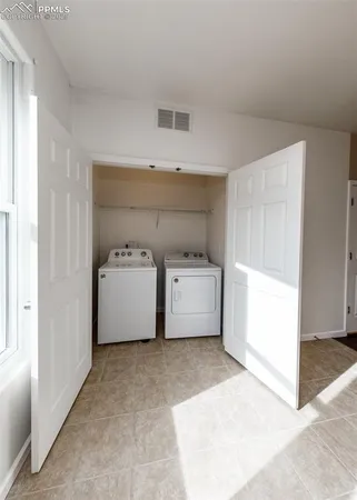 a utility room with a washer and dryer