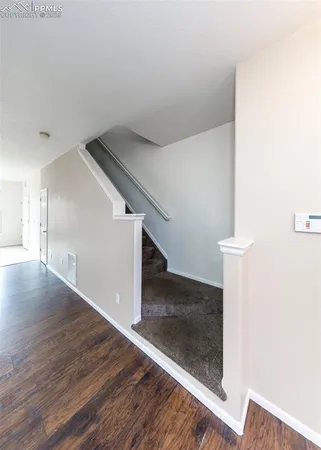 a view of a hallway with staircase