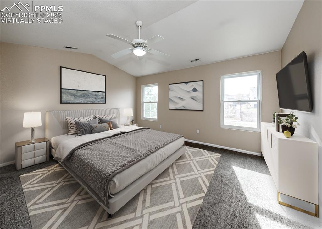 7818 Sandy Springs Point Fountain, CO 80817 - Photo 25 of 46 a bedroom with a bed and a flat screen tv