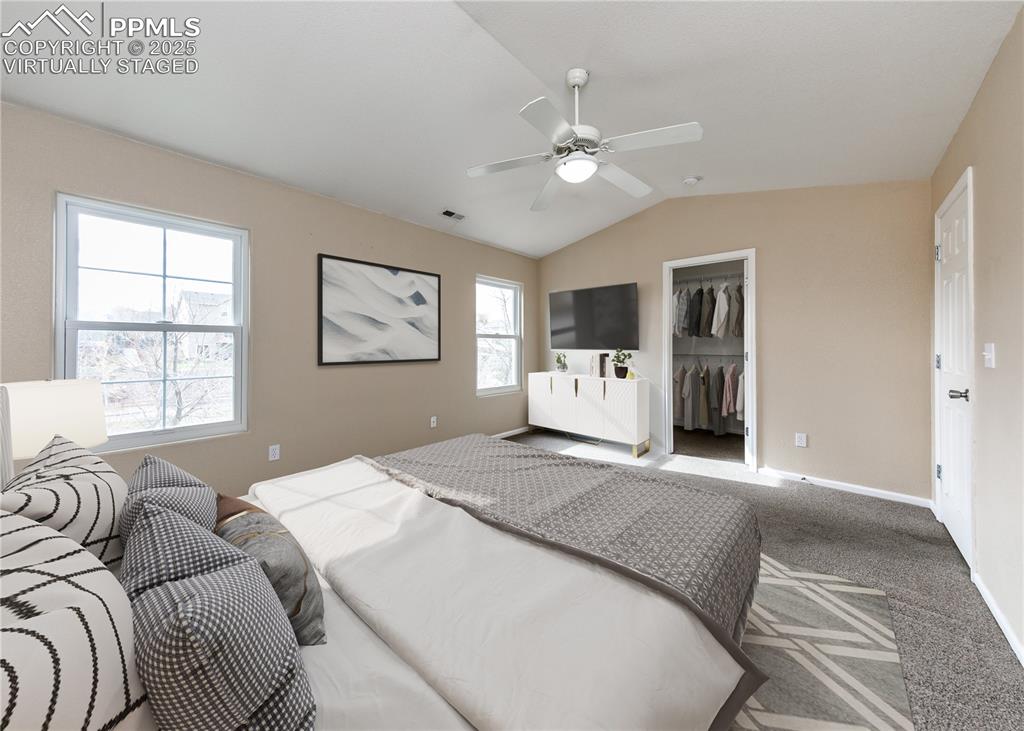 7818 Sandy Springs Point Fountain, CO 80817 - Photo 27 of 46 a spacious bedroom with a large bed and a window
