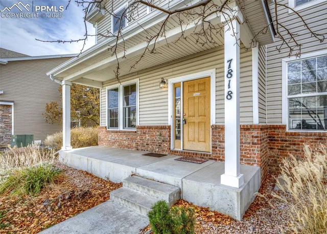 a front view of a house with large windows