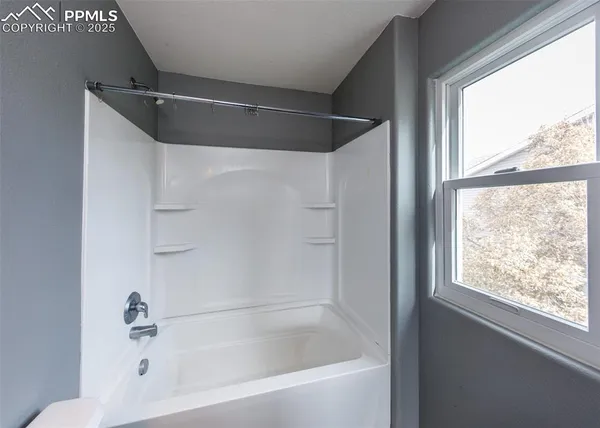 a close view of a bathtub in bathroom