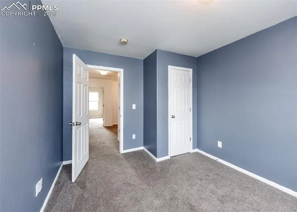 wooden floor and closet in a room