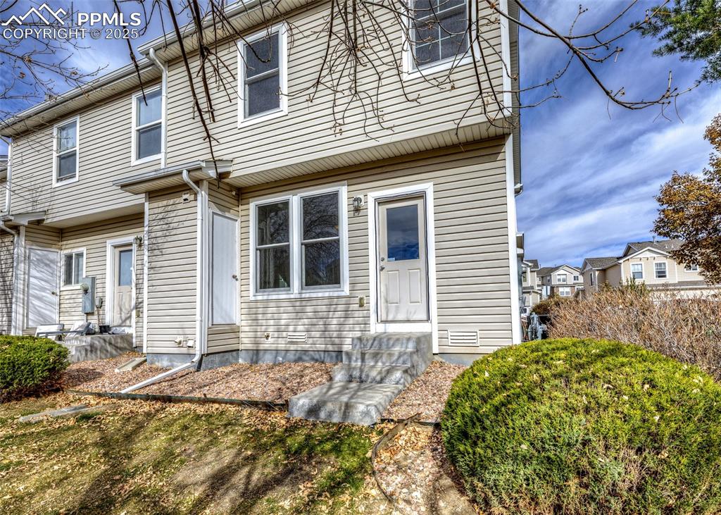 7818 Sandy Springs Point Fountain, CO 80817 - Photo 42 of 46 a front view of a house with a garden