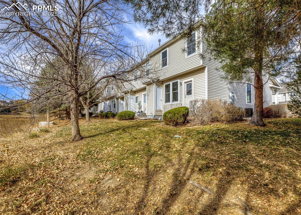7818 Sandy Springs Point Fountain, CO 80817 - Photo 43 of 46 a view of a house with a yard