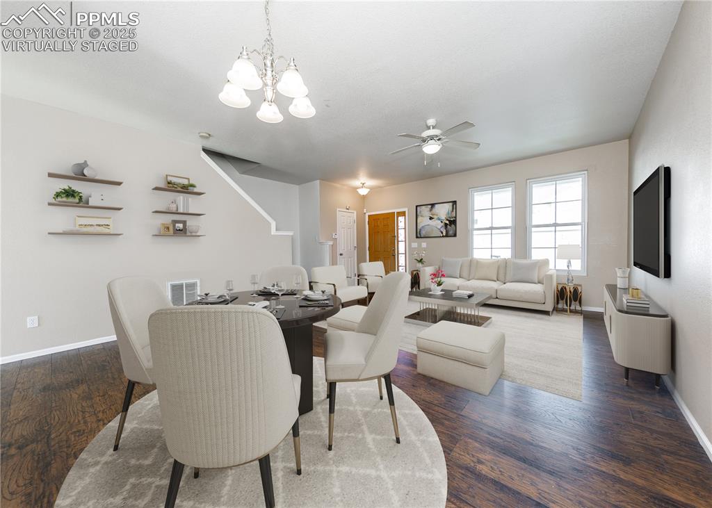 7818 Sandy Springs Point Fountain, CO 80817 - Photo 10 of 46 a living room with furniture or chandelier and a wooden floor