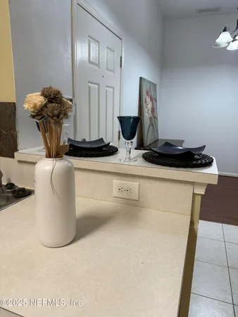 a kitchen with stainless steel appliances granite countertop a sink and a refrigerator
