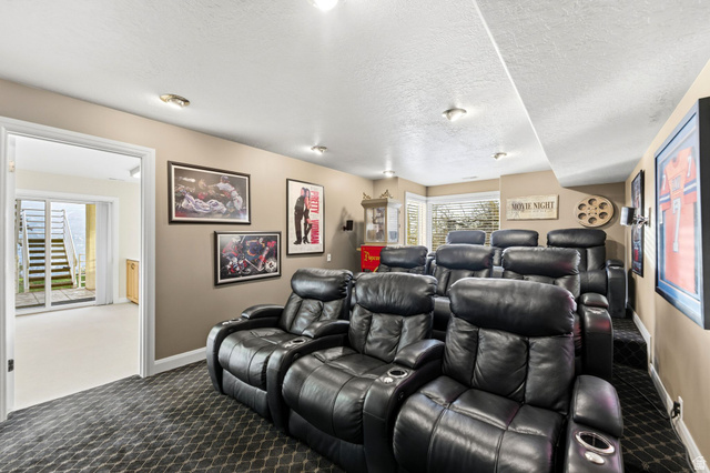 1878 East Ridge Point Drive Bountiful, UT 84010 - Photo 57 of 92 Home theater room featuring carpet floors and a textured ceiling
