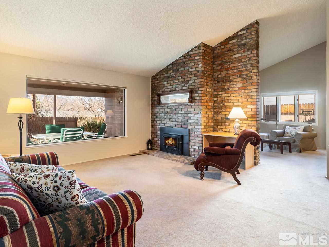2490 Sutter Circle Reno, NV 89503 - Photo 2 of 16 a living room with furniture and a fireplace