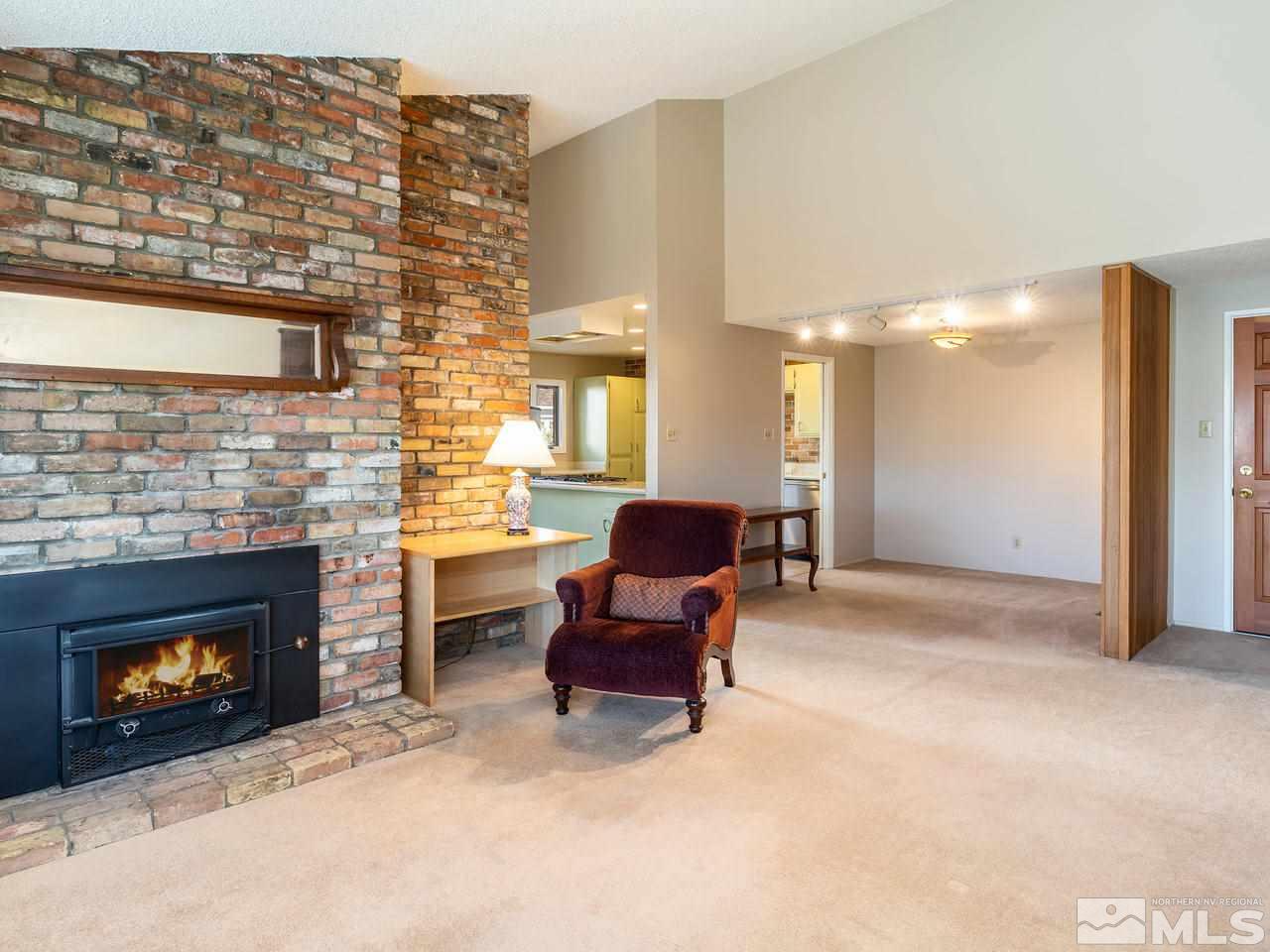2490 Sutter Circle Reno, NV 89503 - Photo 3 of 16 a living room with furniture and a fireplace