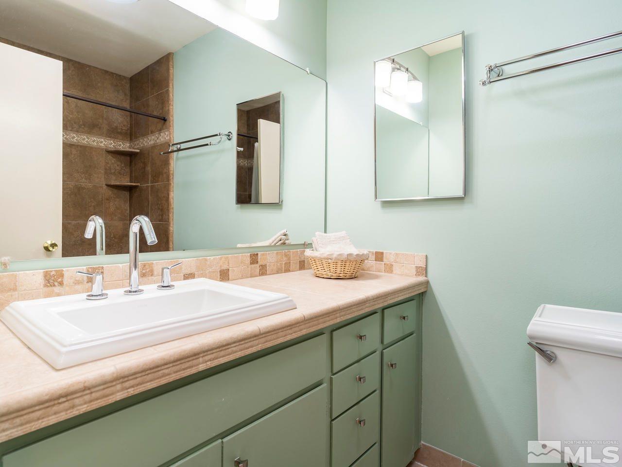 2490 Sutter Circle Reno, NV 89503 - Photo 9 of 16 a bathroom with a sink and a mirror