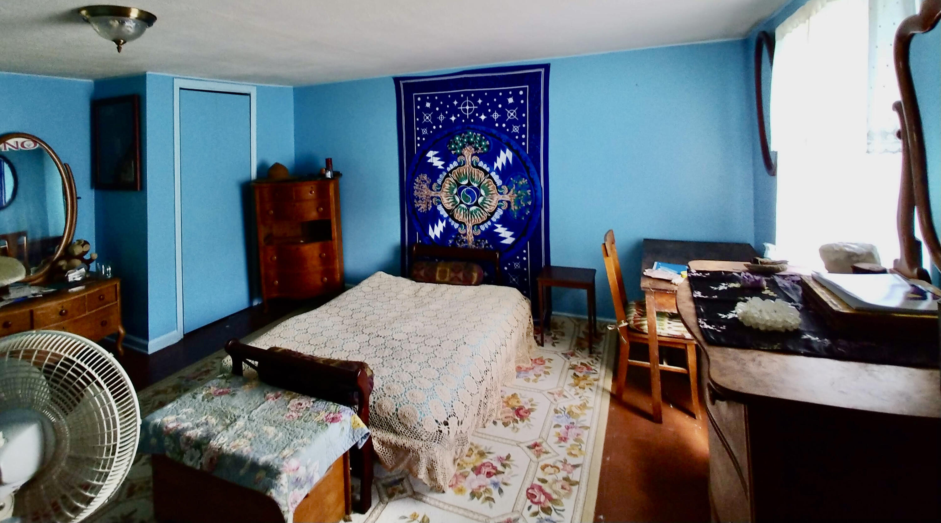 289 Huckleberry Ridge Road Northeast Floyd, VA 24091 - Photo 23 of 36 a bedroom with a bed and a table in it