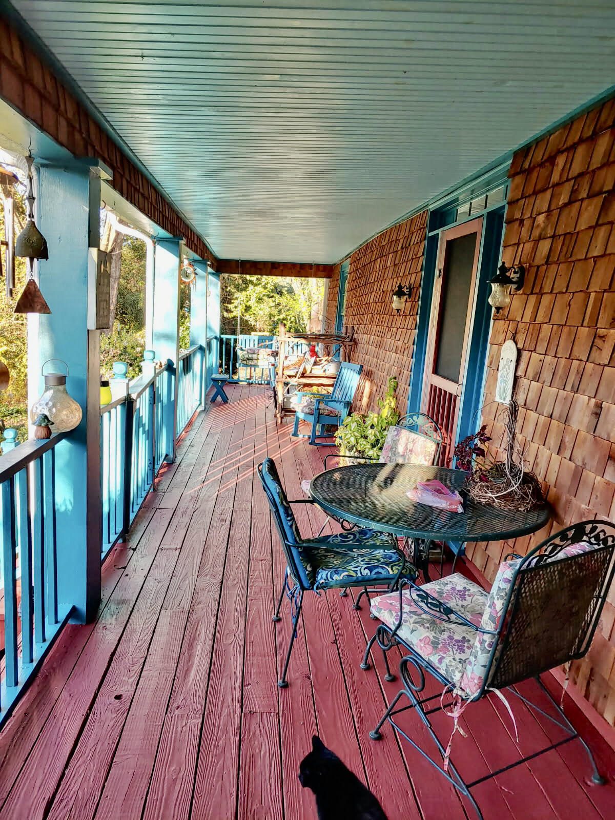 289 Huckleberry Ridge Road Northeast Floyd, VA 24091 - Photo 34 of 36 a view of a patio with table and chairs potted plants with wooden floor