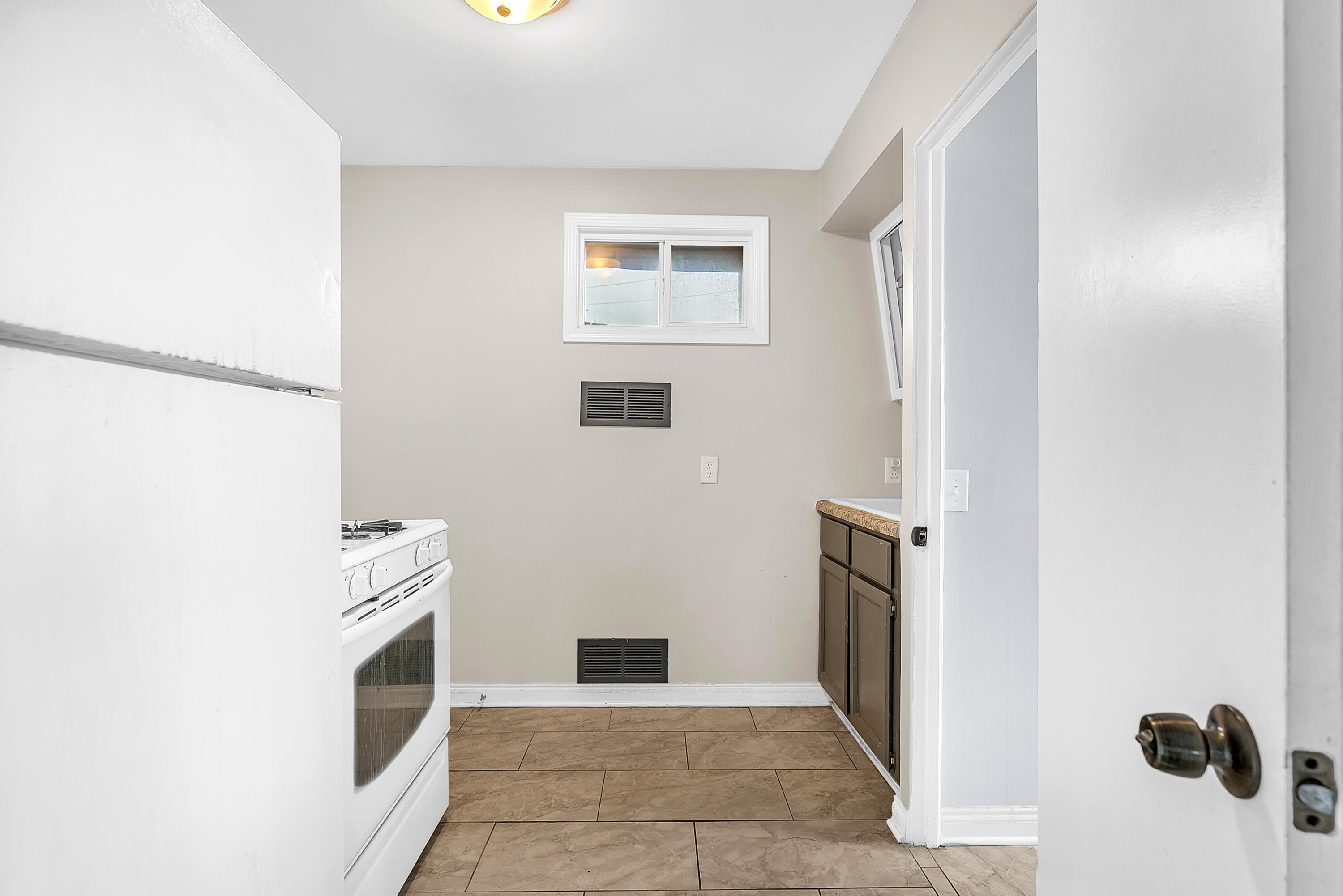 15 Rimbach Street Hammond, IN 46320 - Photo 24 of 31 a view of a kitchen from the hallway with a fireplace