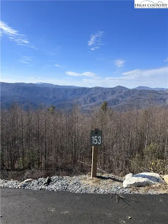 a view of a road with mountains in the background