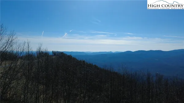 a view of mountain with lake view