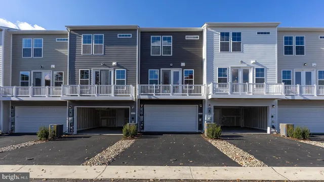 a front view of a building with lot of windows