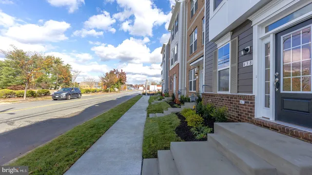 a view of a street with brick building in the background
