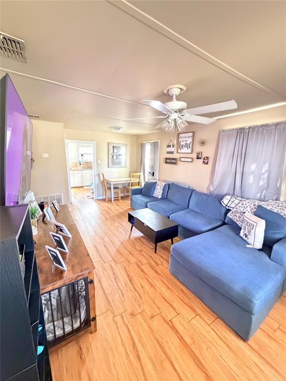 307 West Russell Street Weatherford, TX 76086 - Photo 2 of 9 a living room with furniture and wooden floor