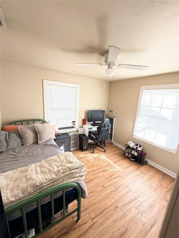 307 West Russell Street Weatherford, TX 76086 - Photo 4 of 9 a bedroom with bed and a window