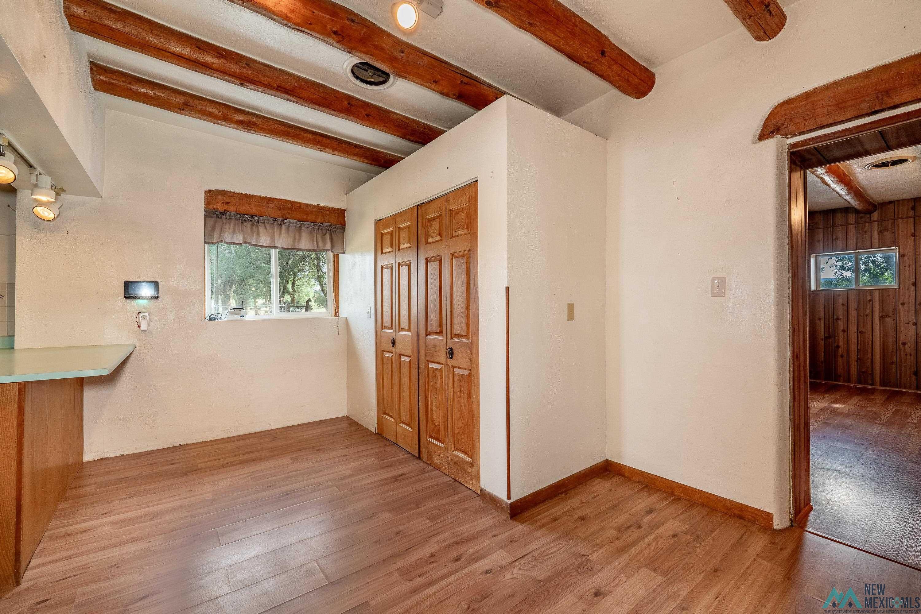 35234 Highway 87 Raton, NM 87740 - Photo 15 of 90 Interior space featuring beam ceiling, light wood finished floors, and healthy amount of natural light