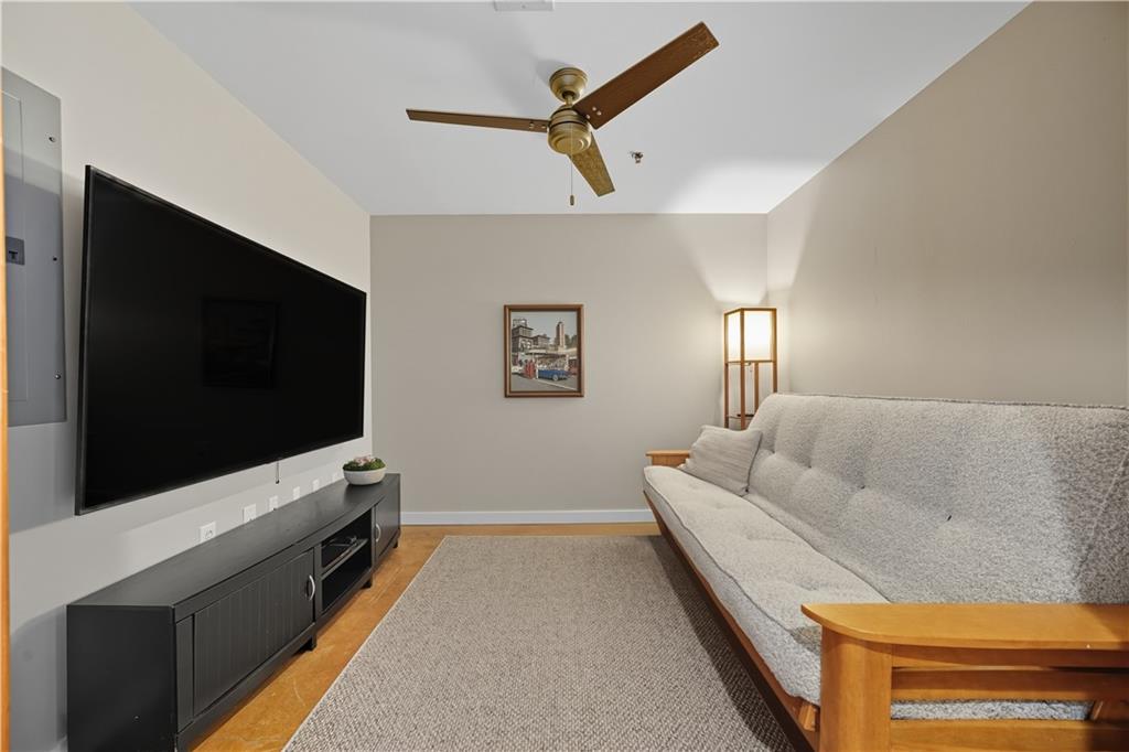 1133 Church Street, Unit 2 Covington, GA 30014 - Photo 14 of 38 a living room with furniture and a flat screen tv