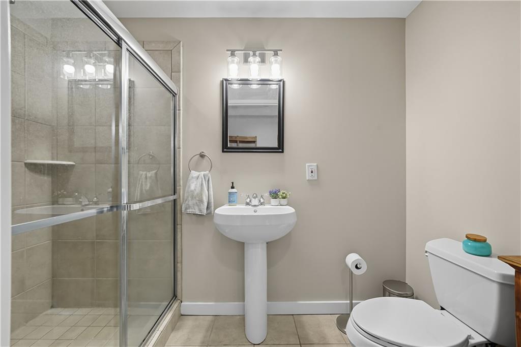 1133 Church Street, Unit 2 Covington, GA 30014 - Photo 25 of 38 a bathroom with a sink toilet and a mirror
