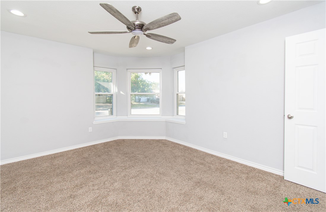 2610 San Jacinto Road Temple, TX 76502 - Photo 12 of 24 an empty room with windows and fan