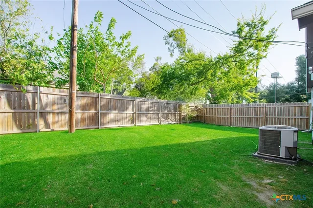 a view of a backyard with a swing