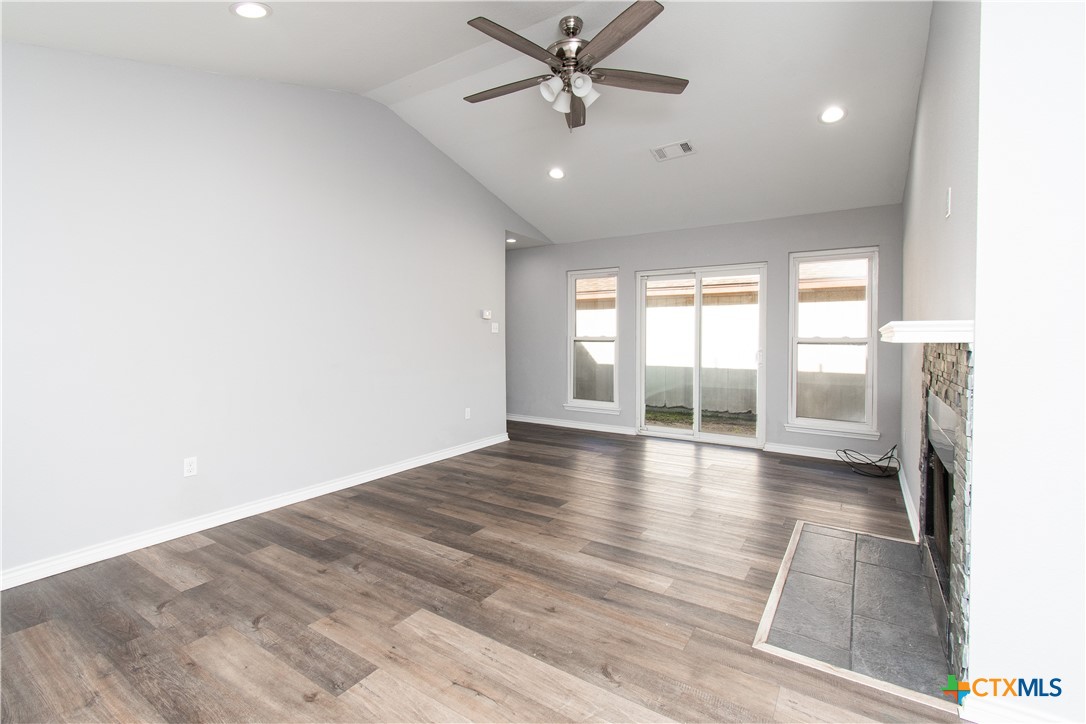 2610 San Jacinto Road Temple, TX 76502 - Photo 5 of 24 a view of an empty room with a window and wooden floor