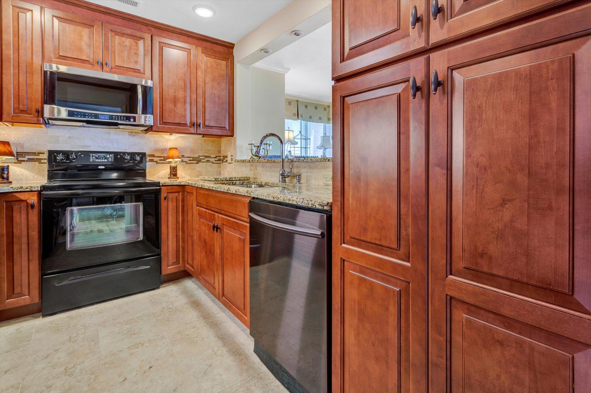 845 Gangplank Road, Unit 207 Moneta, VA 24121 - Photo 12 of 29 a kitchen with stainless steel appliances granite countertop a refrigerator and a stove top oven
