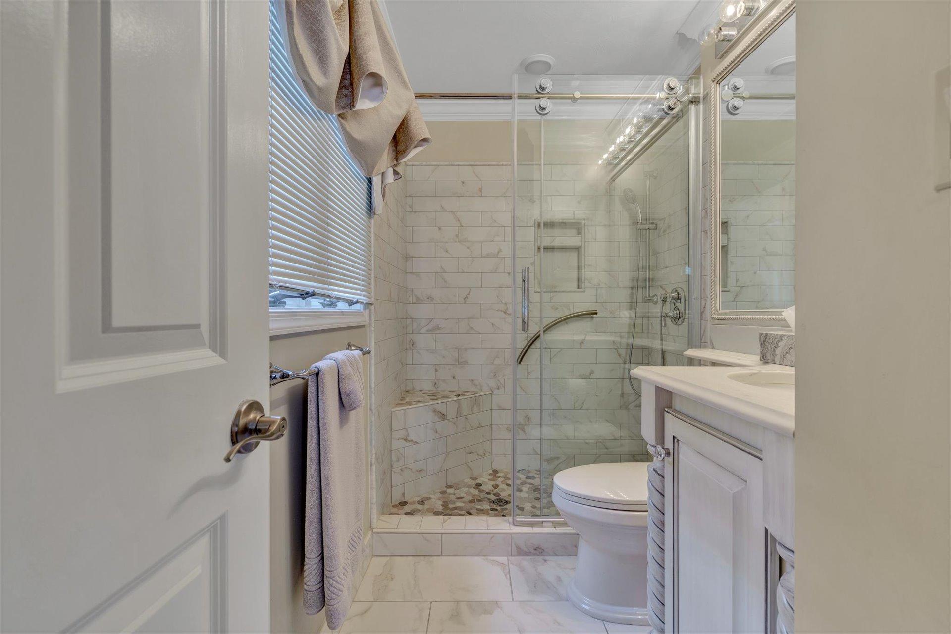 845 Gangplank Road, Unit 207 Moneta, VA 24121 - Photo 22 of 29 a bathroom with a shower a toilet and a sink