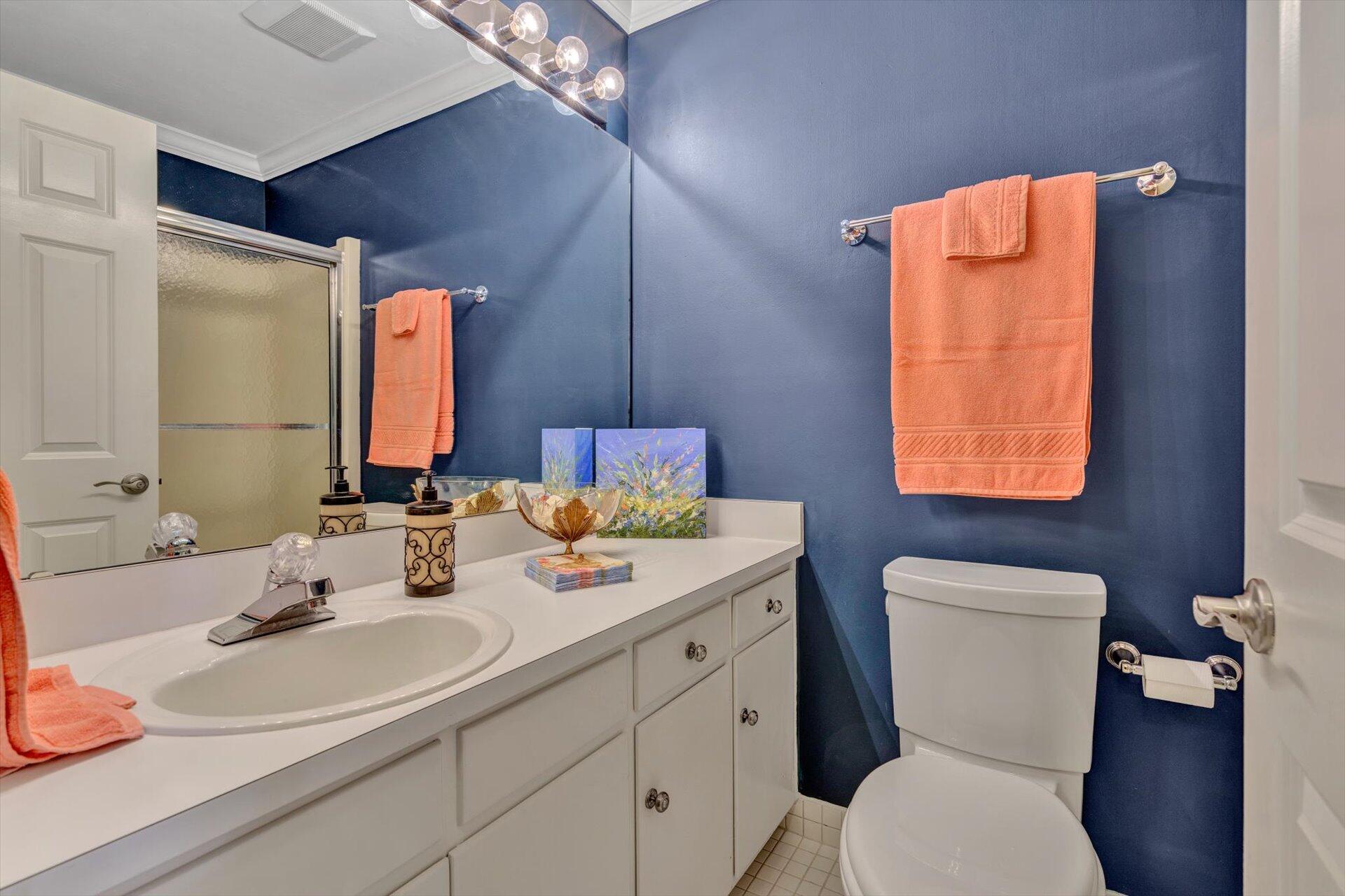 845 Gangplank Road, Unit 207 Moneta, VA 24121 - Photo 25 of 29 a bathroom with a toilet sink and mirror