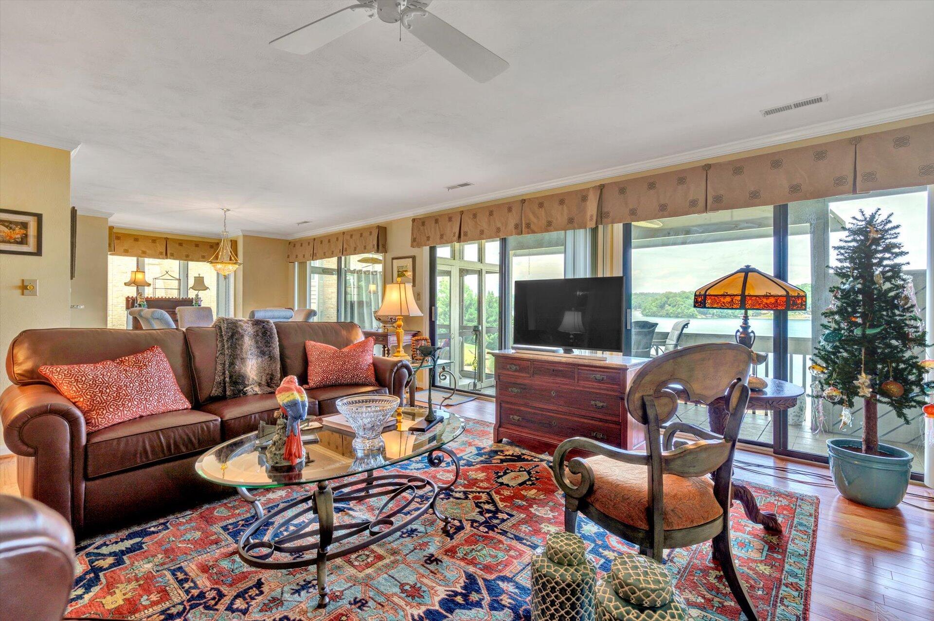 845 Gangplank Road, Unit 207 Moneta, VA 24121 - Photo 7 of 29 a living room with furniture and a flat screen tv