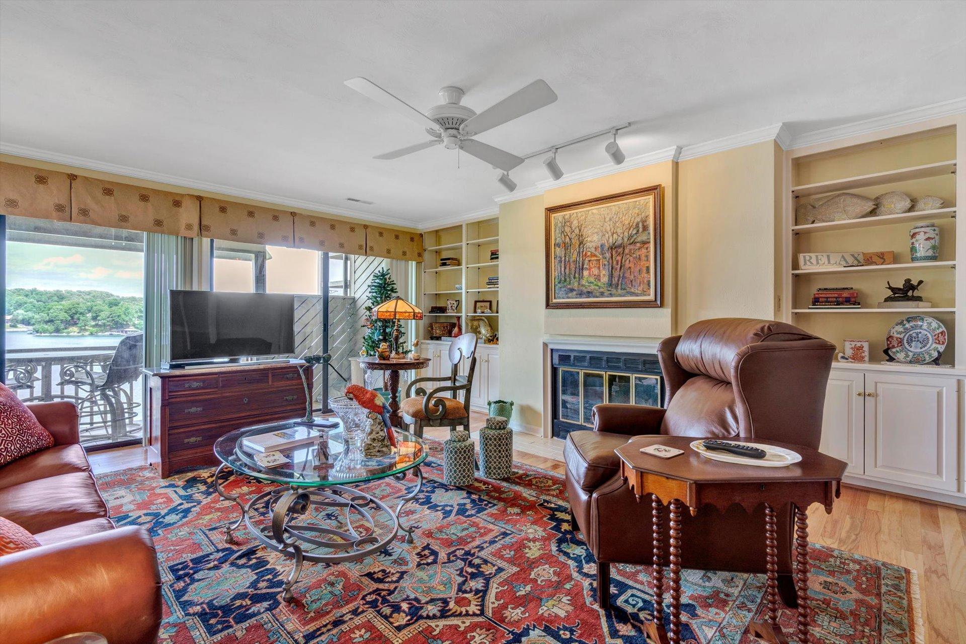 845 Gangplank Road, Unit 207 Moneta, VA 24121 - Photo 8 of 29 a living room with fireplace furniture and a flat screen tv