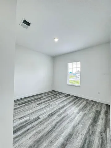 a view of an empty room and window