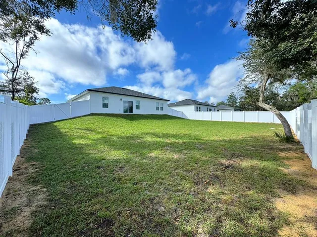 a view of a fountain in front of the house