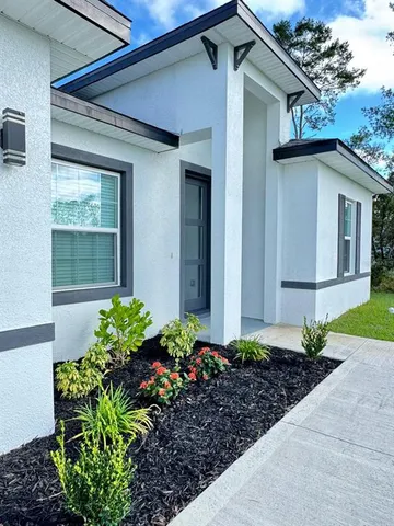 a house with a flower garden