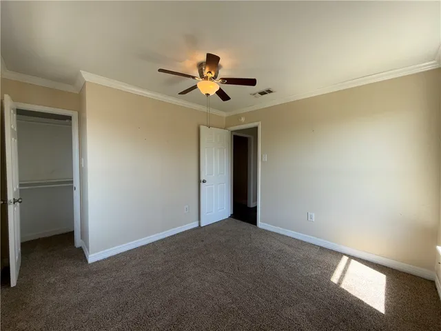 a very nice looking room with a ceiling fan