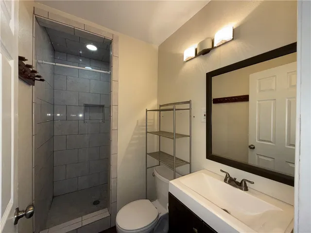 a view of an empty room with a ceiling fan