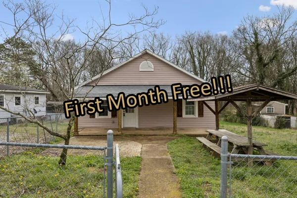 a house with trees in front of it