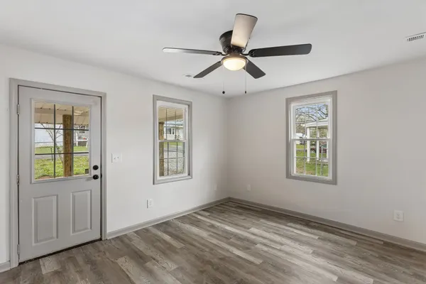 a view of empty room with windows