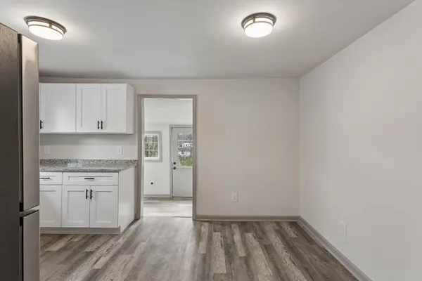 a view of cabinets and wooden floor